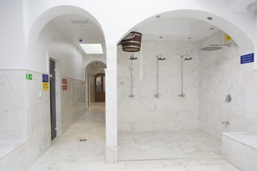 Central heated marble platform surrounded by wash basins where traditional foam massages take place at The Old Hammam and Spa